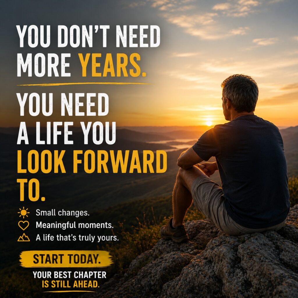 Man sitting on a mountain at sunrise reflecting on life after 50